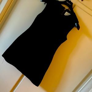 Black dress. Gold Zipper on back. Sleeveless.